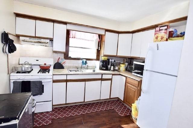 kitchen featuring sink, white cabinetry, white appliances, exhaust hood, and dark hardwood / wood-style flooring