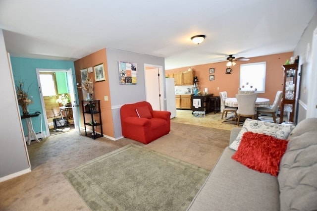 living room with ceiling fan and light colored carpet