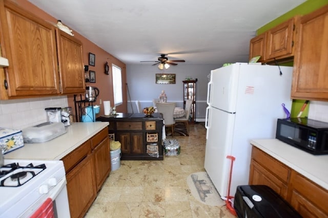 kitchen featuring ceiling fan, white appliances, and decorative backsplash