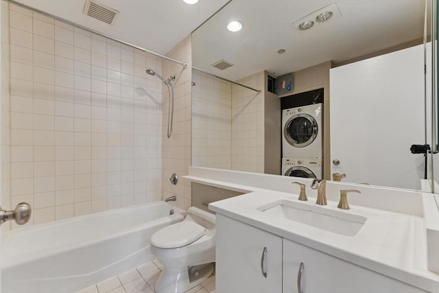 10 Rogers St Unit Ph19, Cambridge, MA 02142 - full bathroom with stacked washing maching and dryer, bathing tub / shower combination, visible vents, and tile patterned flooring