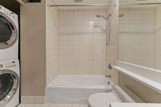 10 Rogers St Unit Ph19, Cambridge, MA 02142 - full bathroom with stacked washer and clothes dryer, toilet, visible vents, and bathtub / shower combination