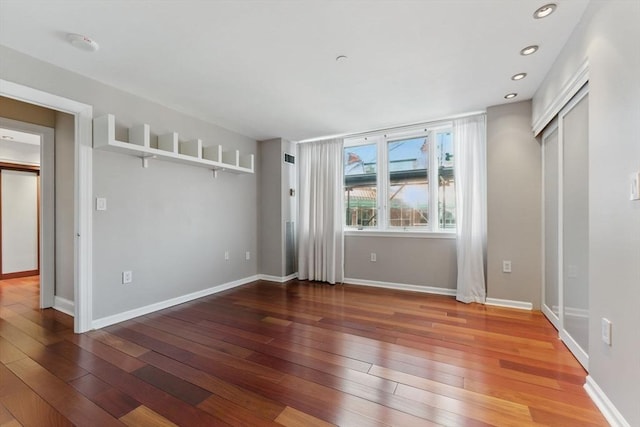 10 Rogers St Unit Ph19, Cambridge, MA 02142 - spare room featuring hardwood / wood-style flooring, baseboards, and recessed lighting