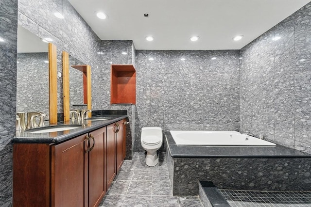 10 Rogers St Unit Ph19, Cambridge, MA 02142 - bathroom with tile walls, a bath, toilet, and a sink