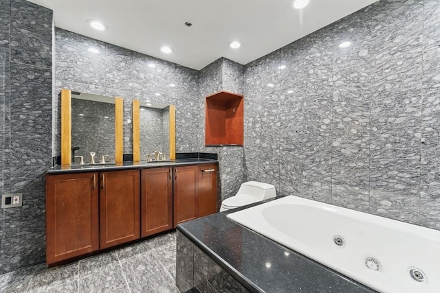 10 Rogers St Unit Ph19, Cambridge, MA 02142 - bathroom featuring a sink, double vanity, a whirlpool tub, and tile walls