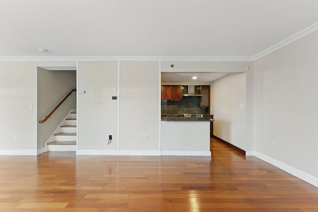 10 Rogers St Unit Ph19, Cambridge, MA 02142 - unfurnished living room with baseboards, stairway, light wood-style flooring, and crown molding
