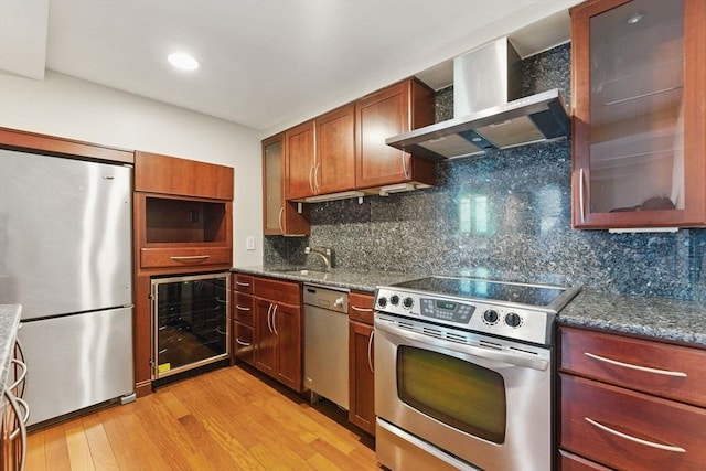 10 Rogers St Unit Ph19, Cambridge, MA 02142 - kitchen featuring a sink, stainless steel appliances, wall chimney range hood, wine cooler, and light wood-style flooring