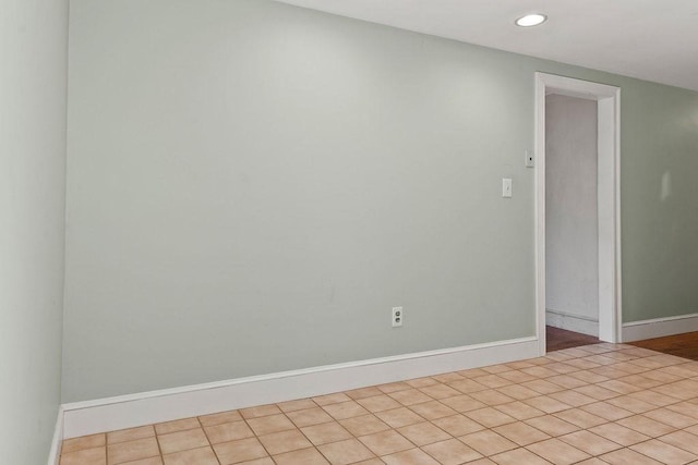 unfurnished room with tile patterned flooring, recessed lighting, and baseboards