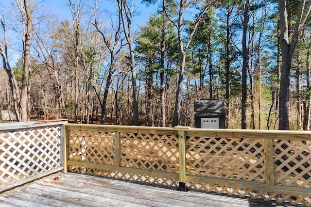 wooden deck featuring an outbuilding