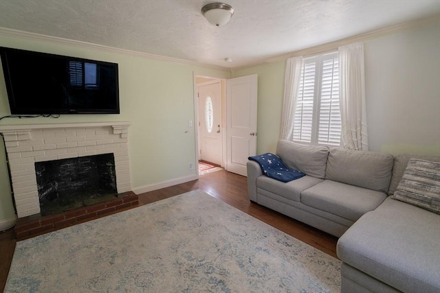 living area with crown molding, baseboards, a brick fireplace, and wood finished floors