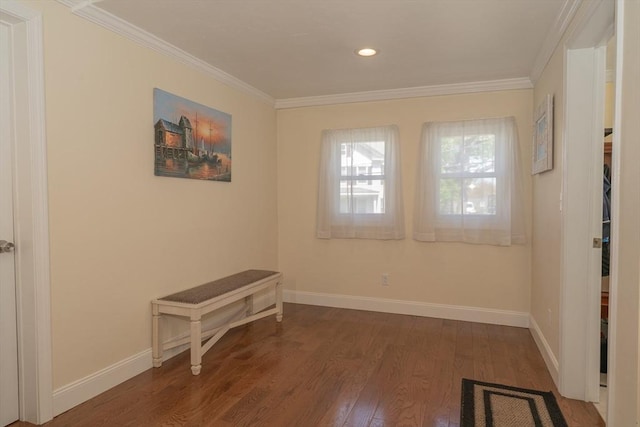 spare room with baseboards, ornamental molding, wood finished floors, and recessed lighting