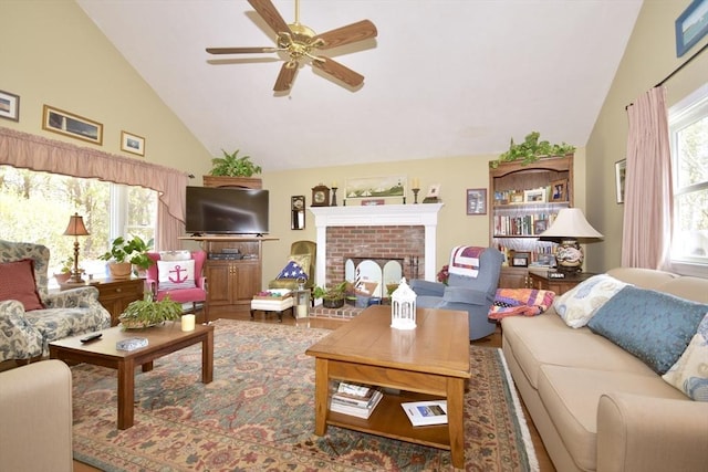 living room with a ceiling fan, high vaulted ceiling, a fireplace, and wood finished floors
