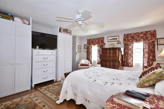 bedroom featuring wood finished floors and ceiling fan