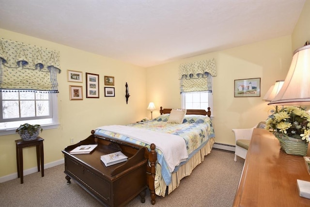 bedroom featuring baseboard heating, carpet flooring, and baseboards