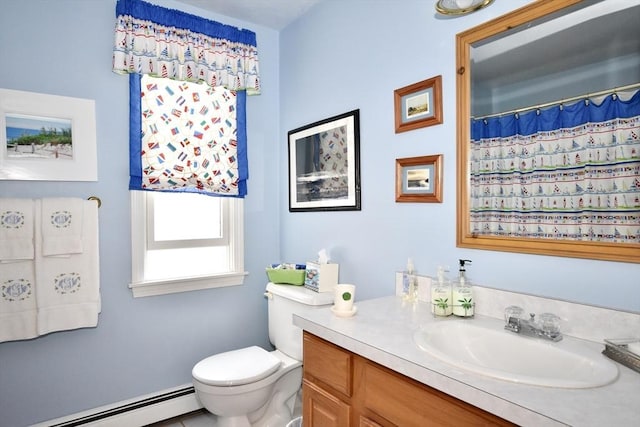 bathroom with baseboard heating, vanity, and toilet