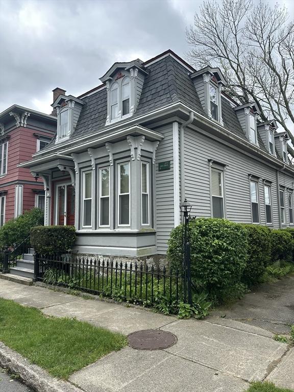 29 Arch, New Bedford, MA 02740 - view of side of home with mansard roof and roof with shingles