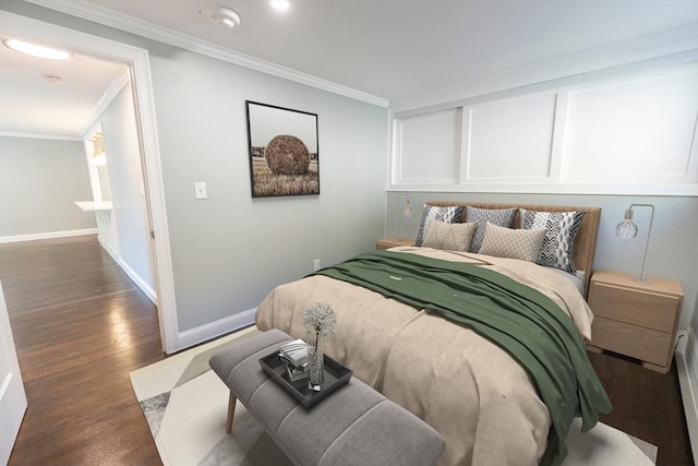 bedroom with ornamental molding and dark wood-type flooring