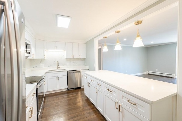 kitchen with white cabinets, hanging light fixtures, tasteful backsplash, stainless steel appliances, and a baseboard radiator