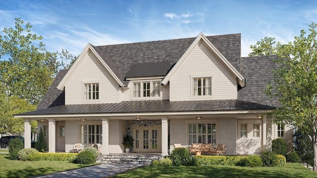 rear view of property with a lawn, french doors, and covered porch