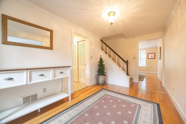 10 Victoria Cir, Norwood, MA 02062 - corridor featuring light wood-type flooring, stairway, and crown molding