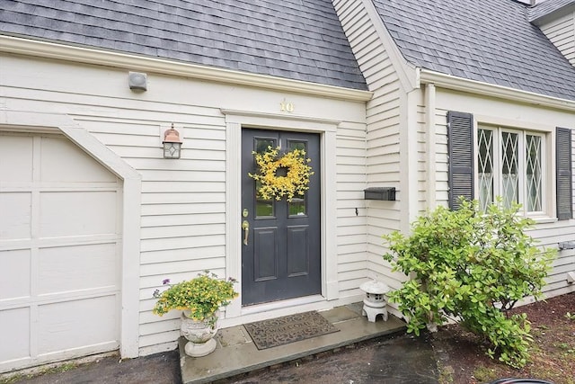 10 Victoria Cir, Norwood, MA 02062 - doorway to property featuring roof with shingles