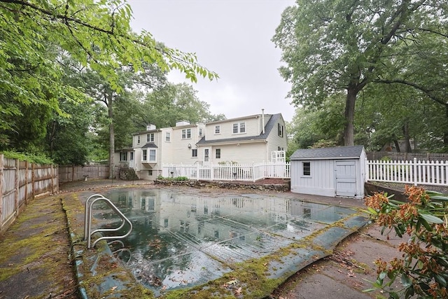10 Victoria Cir, Norwood, MA 02062 - rear view of property with a shed and a fenced backyard