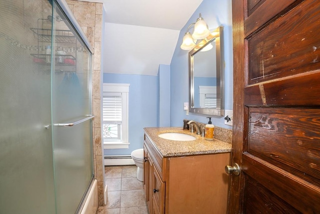 full bathroom with shower / bath combination with glass door, baseboard heating, tile patterned flooring, vanity, and toilet