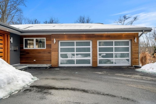 garage featuring driveway