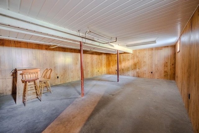 10 Primrose Rd, Billerica, MA 01821 - finished basement featuring wood walls, carpet, and a dry bar