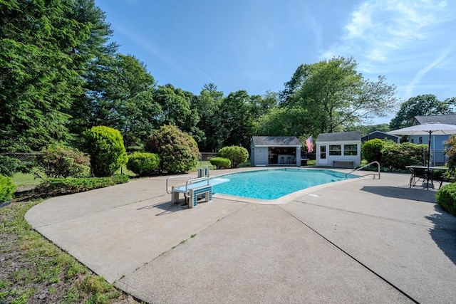10 Primrose Rd, Billerica, MA 01821 - outdoor pool with a patio, an outbuilding, and a diving board