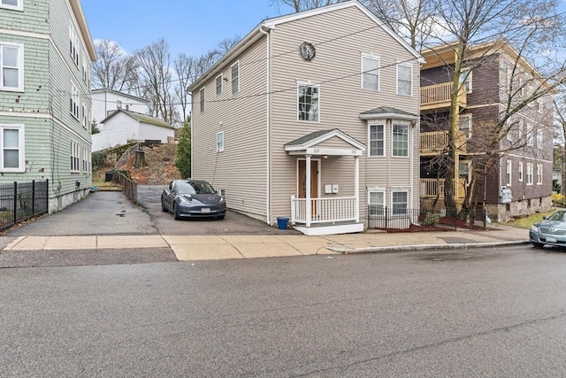 213-215 Florence St Unit 1, Boston, MA 02131 - view of front of home featuring fence