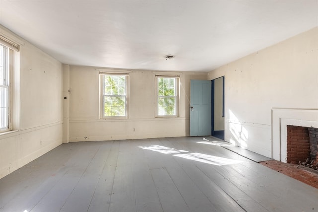 unfurnished living room featuring light wood-type flooring