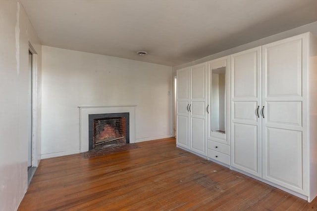 490 Plymouth, Bridgewater, MA 02324 - unfurnished living room with wood finished floors and a fireplace with flush hearth