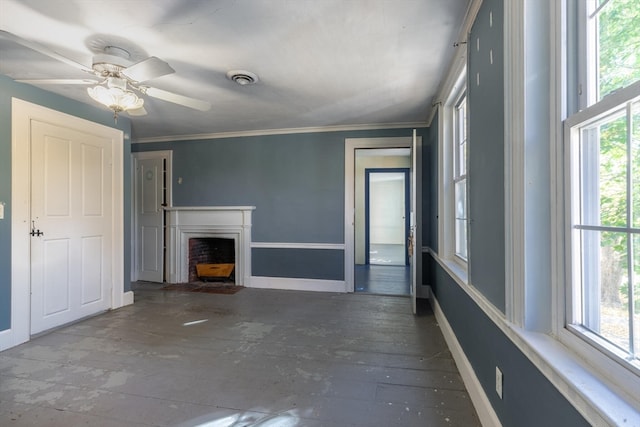 unfurnished living room with crown molding, a healthy amount of sunlight, and ceiling fan