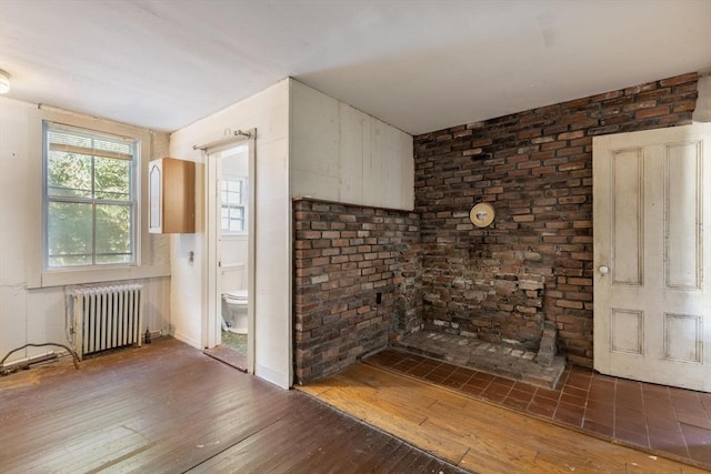 490 Plymouth, Bridgewater, MA 02324 - kitchen featuring radiator heating unit and hardwood / wood-style flooring