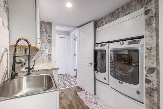 laundry room featuring independent washer and dryer and dark wood-type flooring