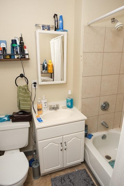 287 W 5th St, Boston, MA 02127 - bathroom with vanity, toilet, bathing tub / shower combination, and tile patterned flooring