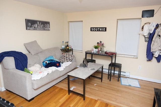 287 W 5th St, Boston, MA 02127 - living area featuring a baseboard radiator, wood finished floors, and baseboards
