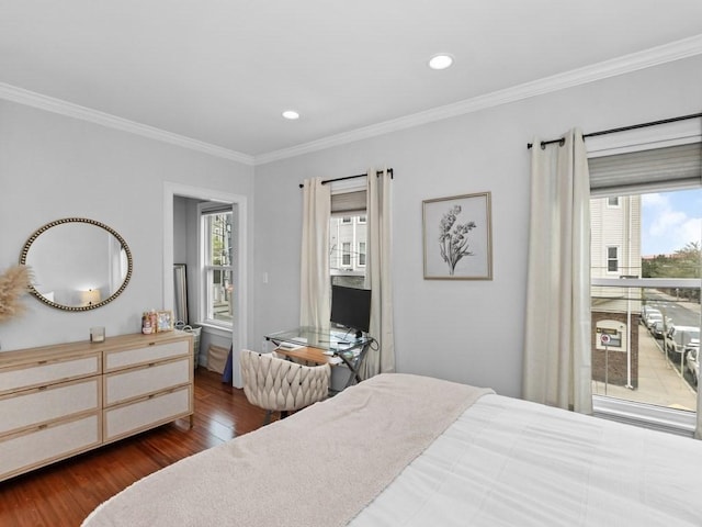 bedroom featuring dark wood-style flooring, ornamental molding, and recessed lighting