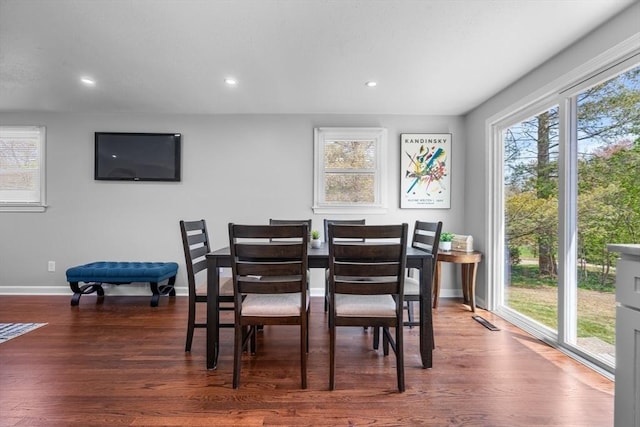 dining room with baseboards, recessed lighting, wood finished floors, and visible vents