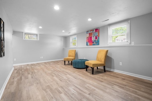 sitting room with recessed lighting, baseboards, visible vents, and wood finished floors