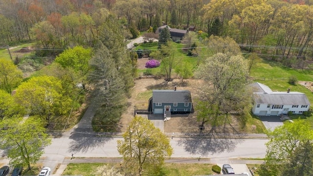 birds eye view of property with a forest view