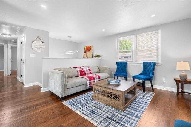 living area with baseboards, attic access, wood finished floors, and recessed lighting