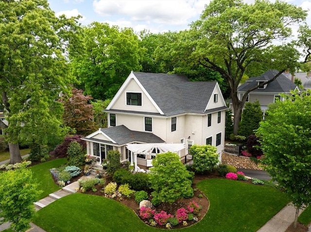 26 Sterling St, Newton, MA 02465 - view of front facade with a front yard and roof with shingles
