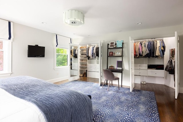 26 Sterling St, Newton, MA 02465 - bedroom featuring baseboards, wood finished floors, multiple closets, recessed lighting, and a desk