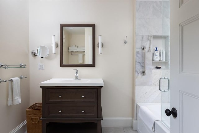 26 Sterling St, Newton, MA 02465 - bathroom featuring vanity, baseboards, tile patterned floors, and shower / bath combination with glass door