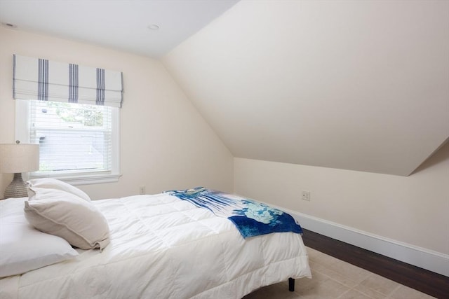 26 Sterling St, Newton, MA 02465 - bedroom with wood finished floors, lofted ceiling, and baseboards