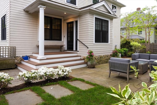 26 Sterling St, Newton, MA 02465 - doorway to property featuring an outdoor living space and a patio