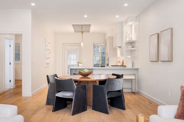 dining room featuring light wood-type flooring