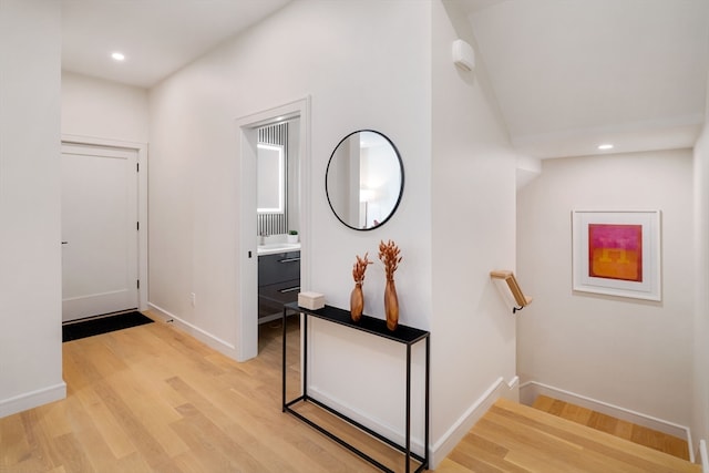 corridor with light hardwood / wood-style floors