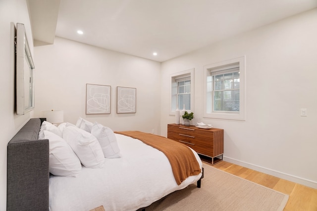 bedroom with wood-type flooring